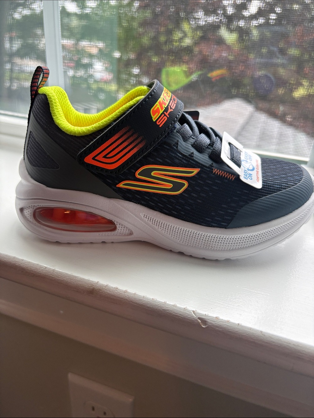 Skechers Kids Navy Blue Sneaker with Neon Yellow and Orange Accents